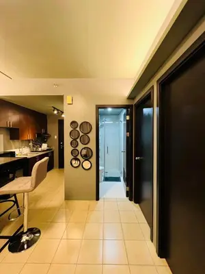 a kitchen with a table and a dining room at C-UY Realtae in Manila