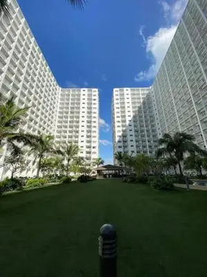 two large buildings with a large lawn in front at Shore Residence D10 Near Mall Of Asia- Airport in Manila