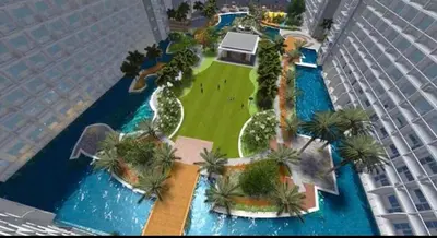 an aerial view of a resort with palm trees and a building at Shore Residence D10 Near Mall Of Asia- Airport in Manila