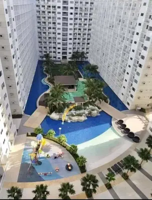 an aerial view of a water park in a city at Shore Residences MOA Staycation in Manila
