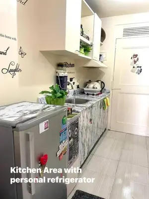 a kitchen with a kitchenarea with personal refrigerators at Borbon's Condo Suite in Manila
