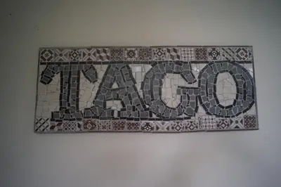 a mosaic tile sign with the word pizza on a wall at Tagaytay Foothills Cherimoya Farm Staycation in Biboyan
