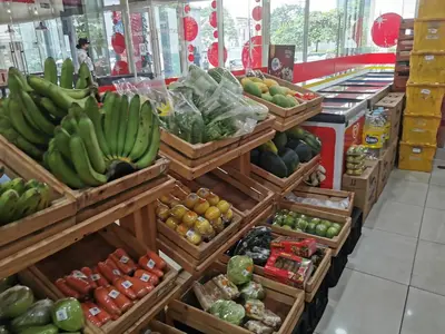 a grocery store with bananas and other fruits and vegetables at Crib's nr.BGC in Manila