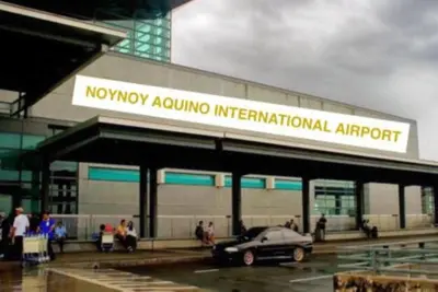 a car parked in a parking lot in front of an airport at Azure Residence A8 Near Sm Mall/Airport +free wifi in Manila