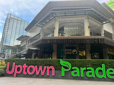 a building with a sign in front of it at Uptown Parksuites II in Manila