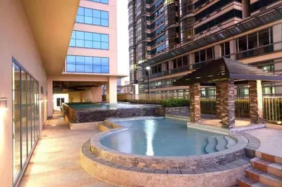 a pool in the middle of a building at Comfy Condo Grand Riviera Suite, Roxas Blvd Ermita Manila infront of US Embassy in Manila