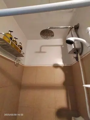 a bathroom with a shower with a shower head at 821 Field Res Condo by Bambie with 2 wifi in Manila