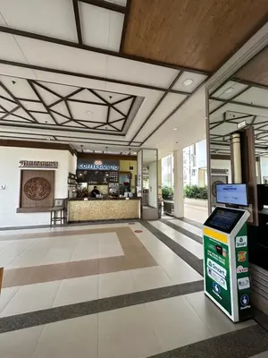 a lobby of a shopping center with a store at Alea Residences in Manila