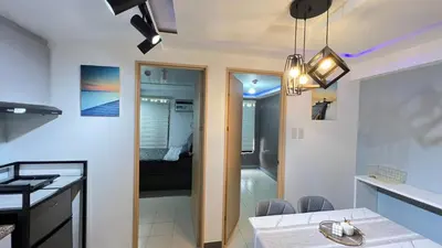 a kitchen and a living room with a dining room at Staycation in Pasig - Near SM East Ortigas in Manila