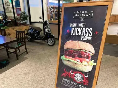 a sign for a restaurant with a sandwich on it at Modern Classic 1 BR Condo Air Residences Makati in Manila