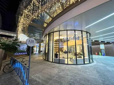 a large building with a store front with a bike in it at Modern Classic 1 BR Condo Air Residences Makati in Manila