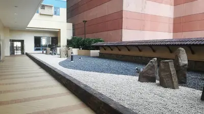 a building with a walkway in front of a building at Grand riviera suites Studio Type Only in Manila