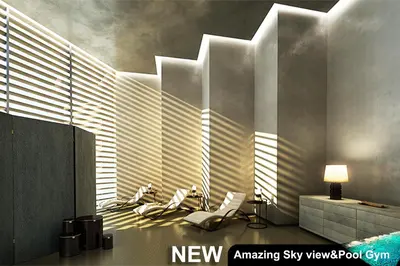 a room with a wall with sunlight streaming through the window at Century Spire Makati in Manila