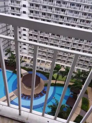 a view from the balcony of a large apartment building at Condo at Shell Residences in Manila