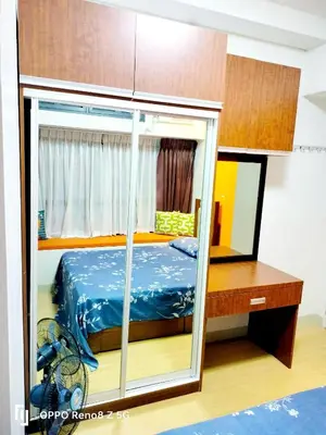 a bedroom with a bed and a mirror at The Levels 2BR Condo Fully Interior Cosmo Living in Manila