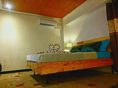 a bedroom with a bed in a room at Adorable Lounge - 1 Bedroom loft w/home cinema in Manila