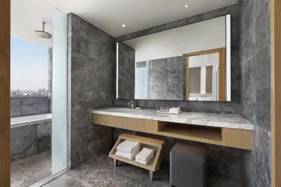 a bathroom with a sink and a mirror at The Westin Manila in Manila