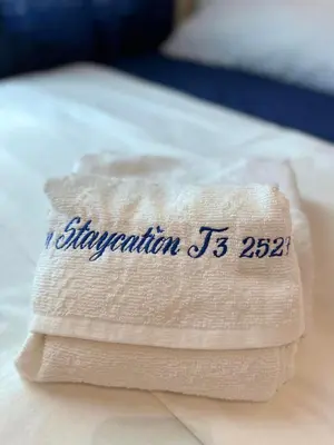 a folded napkin with the words attention is written on it at Modern Condo Living in Makati in Manila