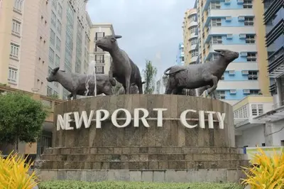a statue of sheep on top of a newport city at Condotel Across Naia Airport with WIFI in Manila