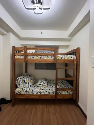 a bunk bed room with two bunk beds at Lumiere suites in Manila