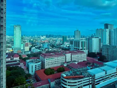 a view of a city with tall buildings at Cozy Condo in Ermita Manila near St Lukes Medical Center and US Embassy in Manila