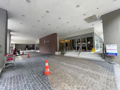 a large building with orange cones in front of it at Cozy Condo in Ermita Manila near St Lukes Medical Center and US Embassy in Manila