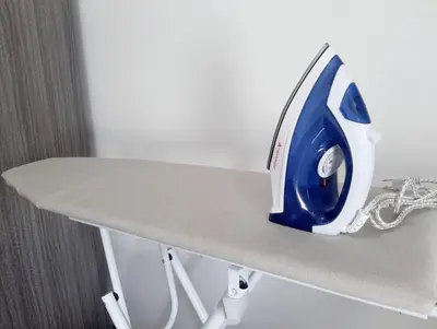 a iron sitting on top of a table at Air Residence Makati in Manila