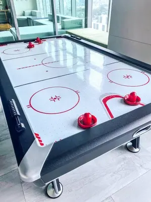 a ping pong table with red balls on it at Modern and homely Condo in Shaw Boulevard in Manila