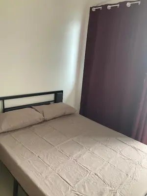 a bed in a small room with a mattress at Penthouse studio at Fame Residence 41st Floor, ShangriLa-Megamall in Manila