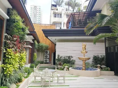 a courtyard with a fountain in the middle of a building at Adria Residences - Emerald Garden - 2 Bedroom Unit for 4 person in Manila