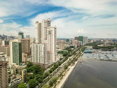 a view of a city with a river and buildings at Loveness Apartelle in Manila