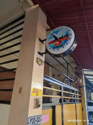 a sign that is on the side of a building at AIRPORT VILLAMOR TRANSIENT ROOMS in Manila