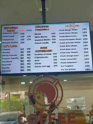 a menu on the window of a fast food restaurant at Coast Residences - 2 Bedroom with Balcony facing Mall of Asia, Manila Bay & Pool View in Manila