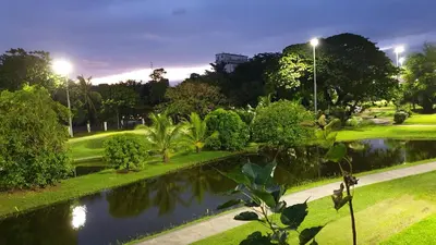 a park with a pond in the middle at MANILA BAY EXECUTIVE SUITE pearl of orient in Manila