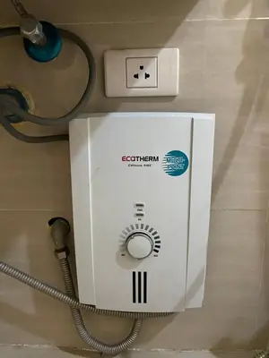 a white electrical box sitting on top of a table at Spacious condo in Venice Luxury Residences in Manila