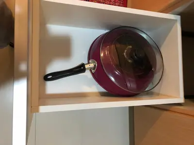 a red wine glass in a cabinet drawer at 101 Newport Boulevard-Favila Condotel Unit near Airport in Manila