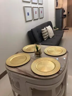 a table with three yellow plates on top of it at Coast Residence 4026 PENTHOUSE 1 Bedroom Condo with Wifi & Netflix in Manila