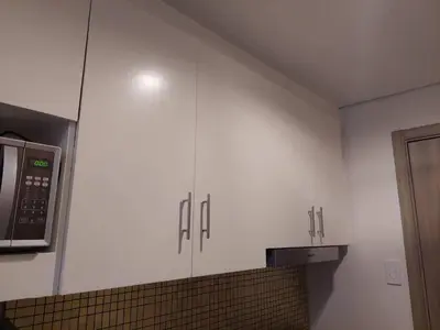 a kitchen with white cabinets and a microwave at Coast Residence 4026 PENTHOUSE 1 Bedroom Condo with Wifi & Netflix in Manila