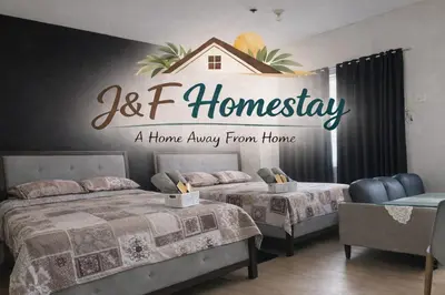 a home away from home bedroom with two beds at J & F Homestay - Cavite, Philippines in Trece Martires