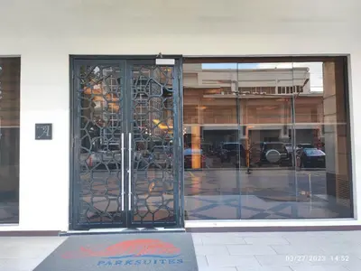 an entrance to a building with a glass door at Larue cozy room in Solemare Parksuites Paranaque in Manila