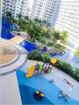 a view of a swimming pool in a resort at Homestay Manila Mall of Asia Shore Residences at TresMarias' in Manila