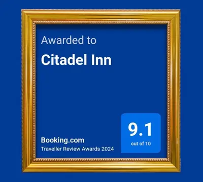 a gold picture frame with the words awarded to circled inn at Citadel Inn in Manila