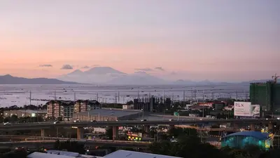 a view of a city with mountains in the background at Bloom Residences Condo 2Br in Manila