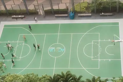 an overhead view of a basketball court with people on it at Aveline Suites Cozy Skyline View ACQUA Private Residences near Rockwell Makati in Manila