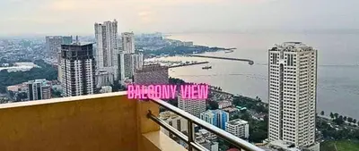 a view of a city with a sign that reads singapore view at Family Room Affordable, Cheapest Deluxe Double Unit in Manila with 2 Balconies & 2 Bathrooms 25 Percent Discount, Free Sauna & Pool Access Near Manila Bay, Robinsons Place Ermita, Pgh, Bellagio, UP, Pedrogil, US Embassy, NAIA Airport Updated 2024 in Manila