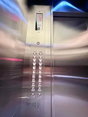 a close up of an elevator with the door open at 9th Queen Size One Bedroom in Grace Residences, Taguig in Manila